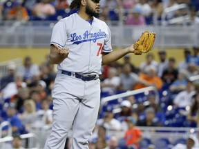 Los Angeles Dodgers relief pitcher Kenley Jansen reacts after Miami Marlins' Dee Gordon was allowed to third on his balk during the eighth inning of a baseball game, Sunday, July 16, 2017, in Miami. (AP Photo/Wilfredo Lee)