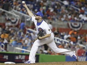 National League's Chicago Cubs pitcher Wade Davis (71), delivers a pitch in the tenth inning, during the MLB baseball All-Star Game, Tuesday, July 11, 2017, in Miami. (AP Photo/Lynne Sladky)