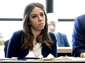 Dalia Dippolito listens to attorneys and Circuit Judge Glenn Kelley discuss jury instructions in her third attempted murder trial in West Palm Beach, Fla.