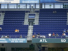 In this Tuesday, June 27, 2017, photo, a section of mostly empty seats is shown during the first inning of a baseball game between the Miami Marlins and the New York Mets at Marlins Park stadium in Miami. As the All-Star Game comes to Florida for the first time, the Marlins and Tampa Bay Rays continue their perennial struggles with attendance, raising the question: Does major league baseball belong in the state? (AP Photo/Wilfredo Lee)