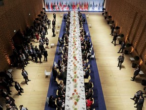 In this July 7, 2017 photo the heads of government of the G-20 states and their partners have dinner after a concert in the Elbphilharmonie concert hall in Hamburg, Germany (Kay Nietfeld/Pool Photo via AP)