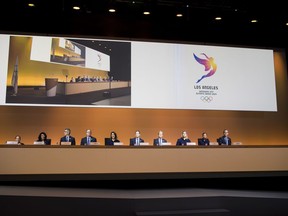 The Los Angeles 2024 delegation attend  the presentation of Los Angeles 2024 Candidate City Briefing for International Olympic Committee (IOC) Members, with,  from left, Candace Cable, Director of Paralympic and Disability Engagement Los Angeles 2024, Anita DeFrantz, IOC Member and Senior Advisor for Legacy of Los Angeles 2024, Casey Wasserman, Chairman of Los Angeles 2024, Larry Probst, IOC member and Chairman of the United States Olympic Committee USOC, Janet Evans, Vice Chairperson and Director of Athlete Relations of Los Angeles 2024, Gene Sykes, Chief Executive Officer of Los Angeles 2024, Doug Arnot, Sport Director of Los Angeles 2024, Angela Ruggiero, US IOC Member and Chair of the International Olympic Committee, Allyson Felix, US Sprinter, and Eric Garcetti, Mayor of Los Angeles at the SwissTech Convention Centre, in Lausanne, Switzerland, Tuesday, July 11, 2017. (Jean-Christophe Bott/Keystone via AP)