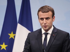 France's President Emmanuel Macron speaks during a press conference after the G-20 summit in Hamburg, northern Germany, Saturday, July 8, 2017, where the leaders of the group of 20 met for two days. He weighed in last week on the controversy surrounding the murder of a Jewish woman by a Muslim man.