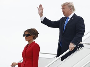 President Donald Trump and first lady Melania Trump arrive on Air Force One at Orly Airport in Paris, Thursday, July 13, 2017. The president and first lady will attend the Bastille Day parade on the Champs Elysees avenue in Paris, France, on Friday, July 14, 2017. (AP Photo/Carolyn Kaster)