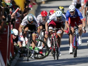 Britain's Mark Cavendish crashes during the sprint to the finish line of the fourth stage of the Tour de France in Vittel, France, on Tuesday, July 4, 2017. Peter Sagan, just in front of Cavdendish, was thrown out of the Tour for elbowing his competitor out of the way.