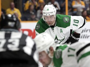 FILE - In this Feb. 12, 2017, file photo, Dallas Stars left wing Patrick Sharp (10) gets ready for a faceoff against the Nashville Predators during the first period of an NHL hockey game in Nashville, Tenn. Sharp, a high-scoring winger who helped the Blackhawks win three Stanley Cup championships before getting traded, is returning to Chicago for a second stint. The 35-year-old veteran agreed to a one-year contract on Saturday, July 1 ,2017. (AP Photo/Mark Humphrey, File)