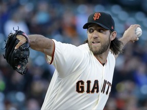 San Francisco Giants starting pitcher Madison Bumgarner works in the first inning of the team's baseball game against the San Diego Padres on Thursday, July 20, 2017, in San Francisco. (AP Photo/Eric Risberg)
