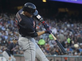 Cleveland Indians' Brandon Guyer hits an RBI triple during the third inning of a baseball game against the San Francisco Giants in San Francisco, Tuesday, July 18, 2017. (AP Photo/Jeff Chiu)