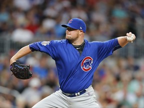 Chicago Cubs starting pitcher Jon Lester works during the first inning of the team's baseball game against the Atlanta Braves on Monday, July 17, 2017, in Atlanta. (AP Photo/John Bazemore)