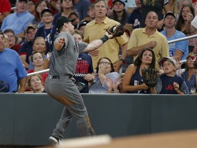 Arizona Diamondbacks first baseman Paul Goldschmidt (44) catches a foul ball off the bat of Atlanta Braves pitcher R.A. Dickey in the fifth inning of a baseball game Friday, July 14, 2017, in Atlanta. (AP Photo/John Bazemore)