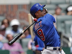 Chicago Cubs second baseman Javier Baez (9) watches the flight of the ball as he follows through on three-run home run in the eighth inning of a baseball game against the Atlanta Braves Wednesday, July 19, 2017, in Atlanta. Chicago won 8-2. (AP Photo/John Bazemore)