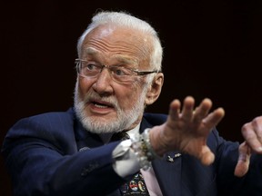 FILE - In this Oct. 22, 2014, file photo, Apollo 11 astronaut Buzz Aldrin, the second person to walk on the Moon, speaks on the campus of Massachusetts Institute of Technology in Cambridge, Mass. Aldrin is hosting a gala for his nonprofit space education foundation, ShareSpace Foundation, at the Kennedy Space Center in Cape Canaveral, Fla., on Saturday, July 15, 2017. The event will raise money and commemorate the 48th anniversary of the Apollo 11 mission. (AP Photo/Steven Senne, File)