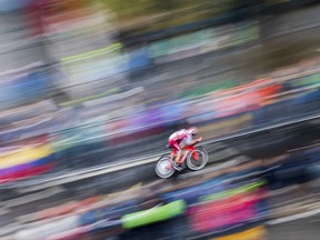 A cyclist competes during his time trial race in Duesseldorf, Germany, Saturday, July 1, 2017. The Tour de France has started in Duesseldorf with a kick-off stage.  ( Rolf Vennenbernd/dpa via AP)