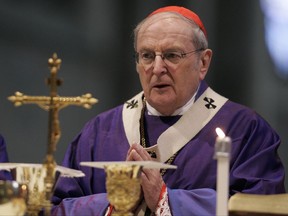 FilE - In this Feb. 10, 2008 file photo Cardinal Joachim Meisner celebrates a mass in the Cologne cathedral, western Germany. (AP Photo/ Roberto Pfeil, file)