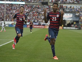 United States' Kellyn Acosta celebrates his goal against Ghana as teammate United States' Dom Dwyer, left, smiles behind him during an international friendly soccer match at Pratt & Whitney Stadium at Rentschler Field, Saturday, July 1, 2017, in East Hartford, Conn. The USA won 2-1. (AP Photo/Jessica Hill)