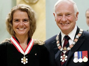 Julie Payette with David Johnston after she was invested into the Order of Canada as Officer during a ceremony at Rideau Hall in Ottawa, Friday September 16 2011.