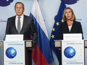 European Union High Representative Federica Mogherini, right, and Russian Foreign Minister Sergey Lavrov address the media after a meeting at the EEAS (European External Action Service) Building in Brussels, Tuesday July 11, 2017. (AP Photo/Geert Vanden Wijngaert)