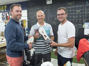 Jeff, Todd and Alex Bishop, left to right, display their handcrafted leather golf club covers at Dormie Workshop, their manufacturing facility in Halifax on Wednesday, July 12, 2017. THE CANADIAN PRESS/Andrew Vaughan