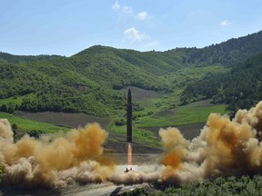 This July 4, 2017 file photo, distributed by the North Korean government shows what was said to be the launch of a Hwasong-14 intercontinental ballistic missile in North Korea.