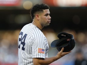 New York Yankees' Gary Sanchez removes his helmet while waiting out a mound conference during the first inning of baseball game against the Toronto Blue Jays in New York, Monday, July 3, 2017. Sanchez and the Yankees Aaron Judge, who lead the Yankees' offense, will participate in the All-Star Home Run Derby July 10 in Miami it was announced Monday. (AP Photo/Kathy Willens)