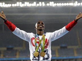 FILE - In this Aug. 20, 2016, file photo, Britain's Mo Farah celebrates winning the gold medal at the men's 5000-meter medals ceremony, during the athletics competitions of the 2016 Summer Olympics at the Olympic stadium in Rio de Janeiro, Brazil. Data posted by Russian-linked hackers show four-time Olympic gold medalist runner Mo Farah's blood readings were once flagged by track's governing body.(AP Photo/Jae C. Hong, File)
