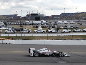 Helio Castroneves, of Brazil, drives his car during the IndyCar Series auto race Sunday, July 9, 2017, at Iowa Speedway in Newton, Iowa. (AP Photo/Charlie Neibergall)