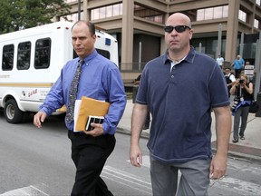 Chicago police officer Thomas Gaffney , left, and former Chicago police officer Joseph Walsh depart the Cook County Courthouse after their arraignment on state felony charges of conspiracy in the investigation of the 2014 shooting death of Laquan McDonald, Monday, July 10, 2017, in Chicago. The indictment marks the latest chapter in the history of a police force dogged by allegations of racism and brutality against the city's black residents. Both pled not guilty on all charges. (AP Photo/Charles Rex Arbogast)