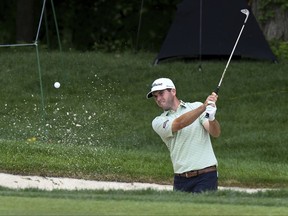 Ben Martin blasts out of the sand at the 9th green during the John Deere Classic golf tournament Wednesday, July 12, 2017, in Silvis, Ill. (Todd Mizener/QCOnline.com via AP)