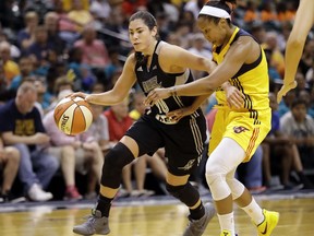 San Antonio Stars' Kelsey Plum goes to the basket against Indiana Fever's Briann January during the first half of a WNBA basketball game, Wednesday, July 12, 2017, in Indianapolis. (AP Photo/Darron Cummings)