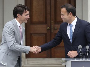 Canadian Prime Minister Justin Trudeau, left, shakes hands with Irish Taoiseach, Leo Varadkar, during a press conference at Farmleigh House in Dublin  Tuesday July 4, 2017. The Canadian PM has several other engagements in Dublin including a meeting with President Michael D. Higgins, a business lunch and a visit to see the Famine memorial statues in the city centre before a state dinner hosted by the Taoiseach. (Niall Carson/PA via AP)