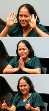 Isabel Martinez, who is charged with killing four of her children and their father, gestures towards news cameras during her first court appearance Friday, July 7, 2017, in Lawrenceville, Ga.