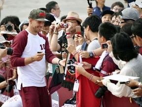 Germany's Lukas Podolski gives his autographs to fans during a welcoming ceremony in Kobe, western Japan Thursday, July 6, 2017. Podolski will play for Japanese club Vissel Kobe. (Tsuyoshi Ueda/Kyodo News via AP)