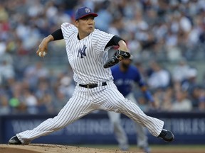New York Yankees starting pitcher Masahiro Tanaka (19) delivers during the first inning of a baseball game against the Toronto Blue Jays in New York, Monday, July 3, 2017. (AP Photo/Kathy Willens)