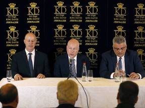 U.S. President Donald Trump's Middle East envoy, Jason Greenblatt, center, Israeli Minister of Regional Cooperation Tzachi Hanegbi, left, and the head of the Palestinian Water Authority, Mazen Ghoneim give a news conference about a water-sharing agreement, in Jerusalem, Thursday, July 13, 2017. Greenblatt announced Thursday that Israel and the Palestinians reached a water agreement linked to a massive planned Red Sea-Dead Sea pipeline project. (Ronen Zvulun/Pool, via AP)