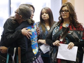 Family members of the Missing and Murdered Indigenous Women and Girls (MMIWG) and Coalition Co-chairs greet each other prior to a press conference calling for a re-organization of the National Inquiry into Missing and Murdered Indigenous Women and Girls (MMIWG) in Winnipeg, Wednesday, July 12, 2017.