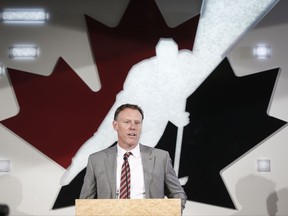 Sean Burke, who will serve as general manager of Team Canada in 2017-18, announces former Vancouver Canucks head coach Willie Desjardins will be Team Canada's head coach at a news conference in Calgary, Alta., Tuesday, July 25, 2017.THE CANADIAN PRESS/Jeff McIntosh