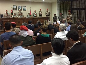 A military court convenes in the case of a Jordanian soldier accused of shooting to death three U.S. military trainers at the gate of an air base, in Amman, Jordan, Monday. July 17, 2017. The defendant had pleaded "not guilty," saying he opened fire because he feared the base was coming under attack. He was sentenced Monday to life in prison with hard labor. (AP Photo/Omar Akour)