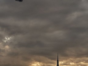 Police patrol over the Empire State building ahead of an Independence Day fireworks celebration Tuesday, July 4, 2017, in New York. (AP Photo/Andres Kudacki)