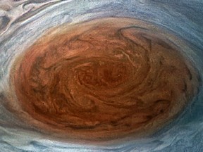 This NASA handout image obtained July 12, 2017 shows the Great Red Spot on Jupiter taken by the Juno Spacecraft on its flyby over the storm on July 11. NASA's Juno successfully peered into the giant storm raging on Jupiter.