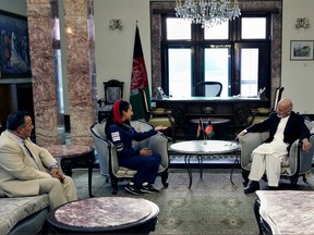 In this Monday, July 10, 2017 photo, Afghan President Ashraf Ghani, second right, meets with Afghan-American female pilot Shaesta Waiz, second left, at the Presidential Palace in Kabul, Afghanistan. Waiz, who is on a solo flight around the world to inspire young women, has taken a detour to visit Afghanistan. Waiz left her single-engine plane in Dubai, the United Arab Emirates, to take a commercial flight to Kabul where she landed on Monday night. Waiz began her journey in May and has since stopped in 11 countries, with eight more to go. (Afghan Presidential Palace via AP)