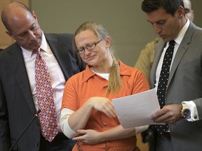 Attorneys flank Angelika Graswald, center, as she cries after pleading guilty to criminally negligent homicide in the kayak-related death of her fiance Vincent Viafore, Monday, July 24, 2017