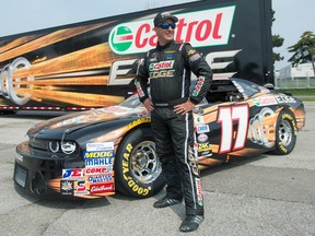 D.J. Kennington is shown with his race car at Ontario Place in Toronto on July 12.