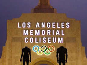 FILE - This Feb. 13, 2008, file photo shows the facade of The Los Angeles Memorial Coliseum in Los Angeles. It was announced Monday, July 31, 2017, that Los Angeles has reached an agreement with international Olympic leaders that will open the way for the city to host the 2028 Summer Games, while ceding the 2024 Games to rival Paris. (AP Photo/Damian Dovarganes, File)