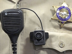 FILE - In this Sept. 22, 2014 file photo, a body camera is displayed at a news conference at the Los Angeles County Sheriff's headquarters in Monterey Park, Calif. California state legislators will hold a hearing on a bill requiring police body camera video to be released after fatal police shootings and other significant incidents. The Senate Public Safety Committee will hold a hearing Tuesday, July 11, 2017, on Assembly Bill 748, which seeks to establish a statewide policy on when body camera should be released. Several law enforcement organizations oppose the measure. (AP Photo/ Nick Ut, File)