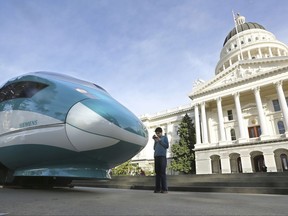 FILE - In this Feb. 26, 2015, file photo, a full-scale mock-up of a high-speed train is displayed at the Capitol in Sacramento, Calif. The California Supreme Court is set to issue a ruling that could have big implications for the state's $64 billion high-speed rail project. The court will decide Thursday, July 27, 2017, whether federal law exempts rail projects such as the planned bullet train between Los Angeles and San Francisco from the state's strict environmental review law known as CEQA. (AP Photo/Rich Pedroncelli, File)