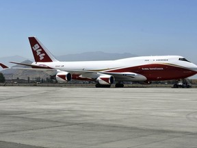 This January 2017 photo provided by Global Supertanker Services shows a Boeing 747 at an airport in Santiago, Chile. The company with the 747 retardant bomber that can drop nearly 20,000 gallons (75,000 liters) on wildfires says federal officials are keeping it grounded, putting homes and ground-based firefighters at risk. Officials with Global SuperTanker filed a protest with the U.S. Forest Service late last month contesting a contract limiting firefighting aircraft to 5,000 gallons. (Jim Wheeler/Global Supertanker Services via AP)