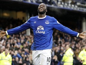 FILE - In this March 18, 2017 file photo, Everton's Romelu Lukaku celebrates scoring against Hull City during the English Premier League soccer match at Goodison Park, Liverpool, England. Lukaku is in trouble for raucous partying in Beverly Hills, Calif. Police said Saturday, July 8, 2017, that he was arrested after officers warned him five times to turn down party music. The 24-year-old plays for Everton in the Premier League, but Manchester United is reportedly trying to sign him to a $97 million (75 million pounds) deal. It's not clear why Lukaku was in the Los Angeles area. Manchester United plays the LA Galaxy in a friendly match next weekend. (Martin Rickett/PA via AP, File)