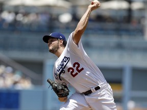 Los Angeles Dodgers starting pitcher Clayton Kershaw throws to the plate during the first inning of a baseball game at bat in Los Angeles, Sunday, July 23, 2017. (AP Photo/Alex Gallardo)