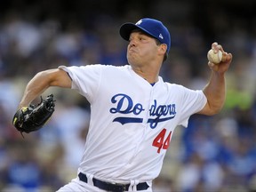 Los Angeles Dodgers starting pitcher Rich Hill throws during the first inning of the team's baseball game against the Arizona Diamondbacks, Thursday, July 6, 2017, in Los Angeles. (AP Photo/Mark J. Terrill)