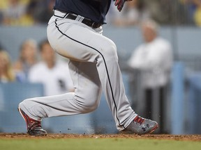 Atlanta Braves' Jaime Garcia watches his grand slam off Los Angeles Dodgers starting pitcher Alex Wood during the fifth inning of a baseball game in Los Angeles, Friday, July 21, 2017. (AP Photo/Kelvin Kuo)